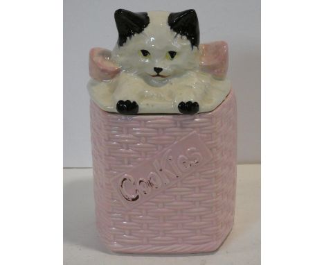 A vintage ceramic painted McCoy pottery, USA kitten in a basket lidded cookie jar. Makers stamp to base. 