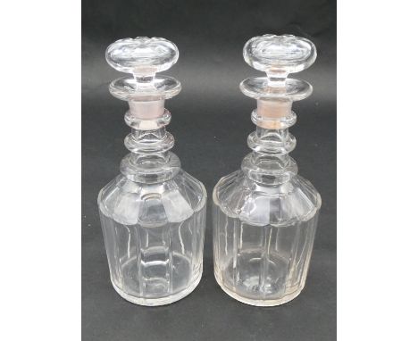 A pair of cut and facetted Georgian decanters of mallet form with three ring necks and original stoppers. H.25cm 