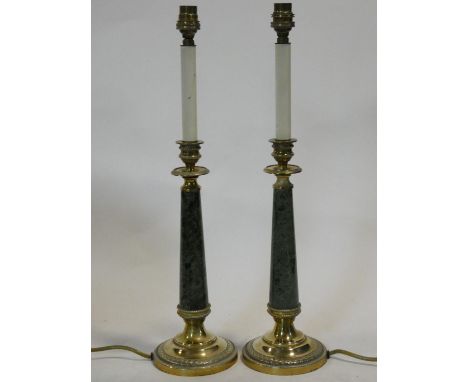 A pair of vintage brass and marble table lamps in the form of candles in their stands. H.51cm 