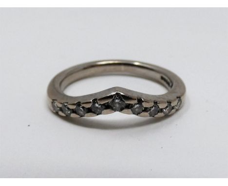 A vintage wishbone 18ct white gold and diamond half eternity ring. Set with nine round brilliant cut diamonds in open back cl