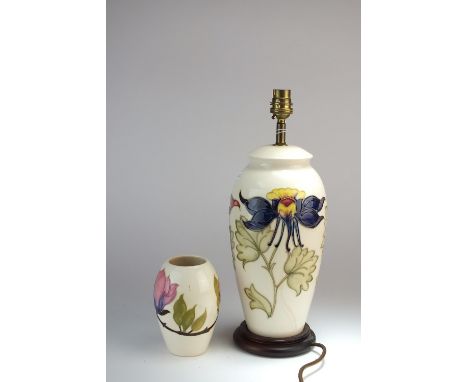 A Moorcroft lamp base in the Columbine pattern against a cream ground, overall height 36.5cm high and a modern Moorcroft vase