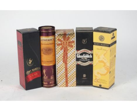A box containing Remy Martin VS Grand Cru, Remy Martin Fine Champagne Cognac VSOP, Martell Cognac Chantanel Pinot Noir 1988 a