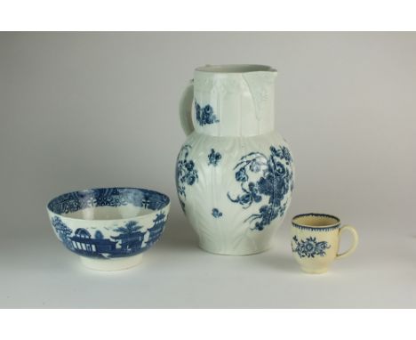 A Caughley blue and white transfer-printed cabbage leaf moulded and mask head jug (cracked), 24cm high, a Liverpool blue and 