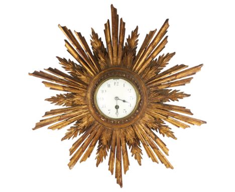 A French giltwood 30-hour sunburst wall clock, white enamel dial with Arabic numerals, overall diameter 55cm, working orderMo
