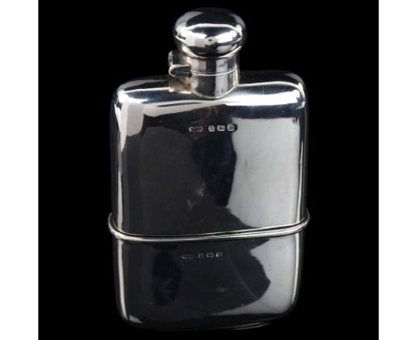 A George V curved silver spirit flask, with screw-lock button cap and removeable beaker with gilt interior, by Marples & Beas