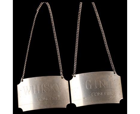 A pair of silver Concorde decanter labels, comprising Whisky and Gin, by British Airways, hallmarks Birmingham 1986, width 5c