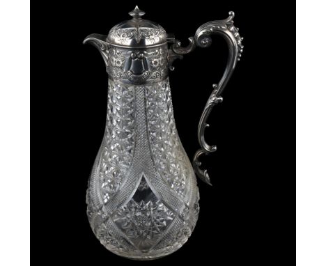 An Edwardian silver-mounted glass Claret jug, relief embossed floral decoration with acanthus leaf handle and hobnail glass, 