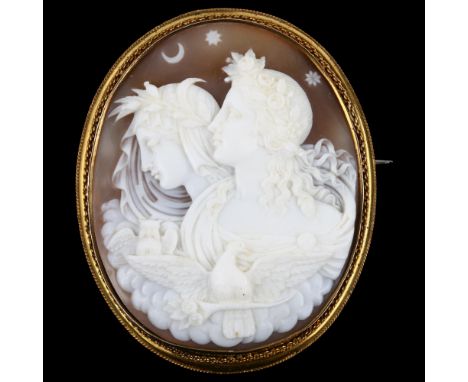 A 19th century shell cameo brooch, relief carved depicting Eos and Nyx (Goddesses of dawn and night), in unmarked yellow meta