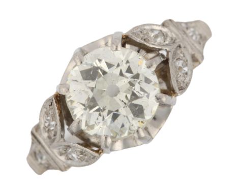 A 1.3ct solitaire diamond ring, unmarked white metal settings with claw set old European-cut diamond and old-cut diamond flor