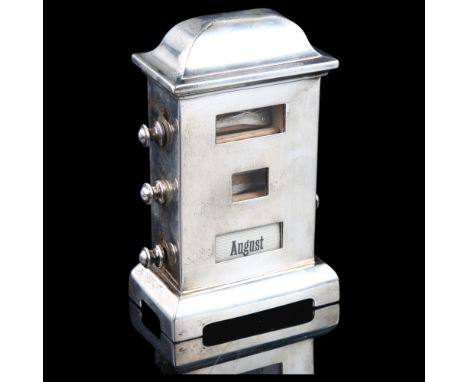 An Edwardian novelty silver desk perpetual calendar, possibly by Henry Matthews, hallmarks Birmingham 1903, height 13cmDay an