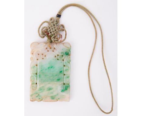 A rectangular carved jade pendant, measuring approx. 6.4cm x 4.4cm, with attached cord, total weight 49.88gm.
