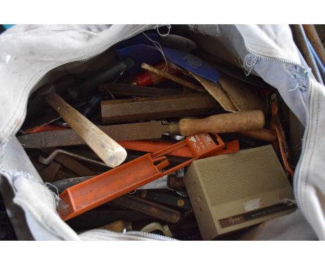 toolbag containing various hand tools files, drill bits, spanners etc