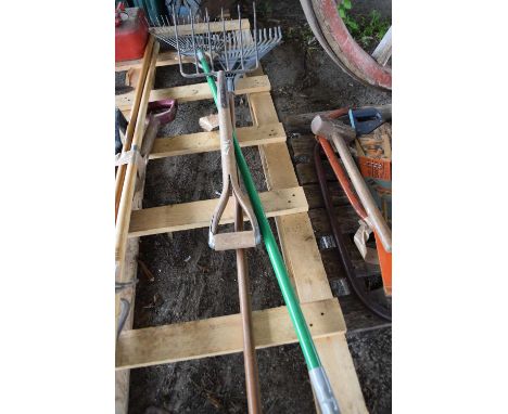 Two garden rakes and a hay fork