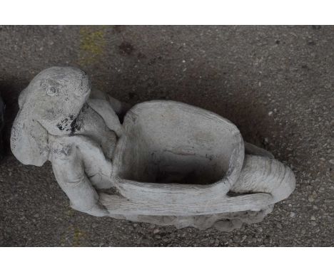Composite garden planter of a rabbit with a wheelbarrow, width approx 50cm