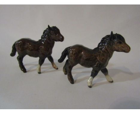 A pair of Beswick Shetland Foals in brown gloss, model no's 1034      