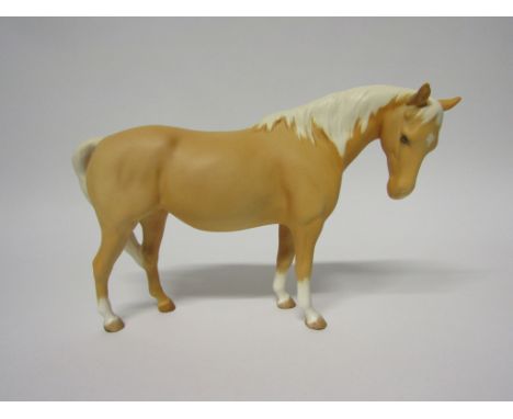 A Beswick Mare (facing right, head down) in Palomino matt, model no. 1812