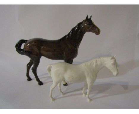 A Beswick Swish tail horse in brown gloss, model no. 1182 together with a Beswick Mare facing right in white matt, model no. 