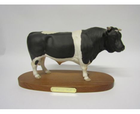 A Royal Doulton Friesian Bull - on wooden plinth, model no. A2580