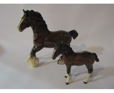 A Beswick cantering Shire in brown gloss, model no. 975, together with a Shire foal in brown gloss, model no. 1053