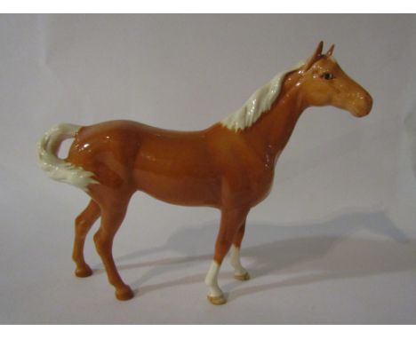 A Beswick Swish Tail Horse in Palomino gloss, model no. 1182