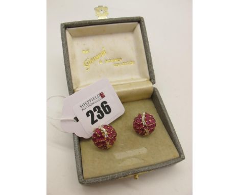 A Pair of Modern Ruby and CZ Set Cluster Earrings, of circular domed design, claw set throughout, with articulated post and c