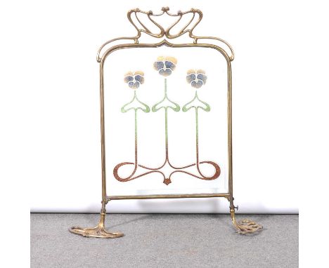 Art Nouveau brass and glass firescreen, sinuous strap surmount above a shaped and bevelled glass panel with coloured sand use