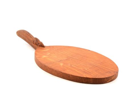 Robert 'Mouseman' Thompson of Kilburn, an oval oak cheeseboard, carved signature mouse to the handle, length 37cm, width 18cm