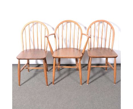 Ercol, a trestle dining table and six hoop-back chairs, including two armchairs, length 153cm, width 77cm, height 71cm.Qty: 7