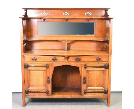 English Arts &amp; Crafts oak sideboard, by Shapland &amp; Petter of Barnstaple, the upper gallery pierced with flower bud fo