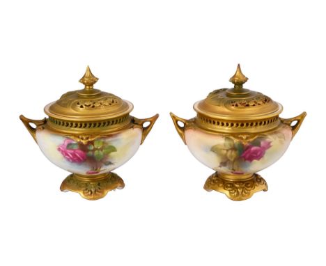 A near pair of Royal Worcester lush ivory twin handled pot pourri vases and covers shape 165, both decorated with sprays of r