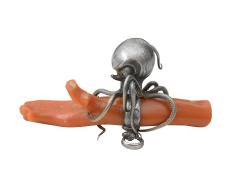 A 19th century Japanese netsuke of a silver octopus grasping a stick of coral Edo/Meiji period the octopus with gilt inlaid e