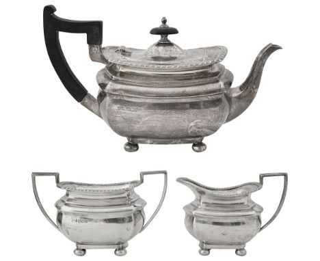 A late Victorian silver three piece bachelor's tea serviceSheffield, 1900 Walker &amp; Hallof plain oblong bellied form with 