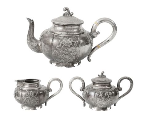 An early 20th century Chinese export silver three piece tea servicestamped Wn for Wing Nam, artisans mark of compressed circu