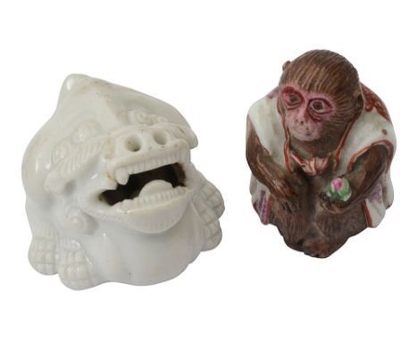 Two 19th Japanese Hirado porcelain netsukeEdo/Meiji period first in the form of seated shishi, with raised head and open mout