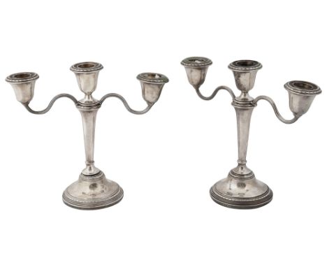 A pair of Elizabeth II silver three light candelabra Birmingham, 1960, Adie Bros Ltdwith detachable scroll arms, on tapering 