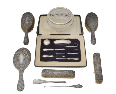 An Edwardian seven piece silver handled dressing setChester, Birmingham, 1901, all in the Rococo style, with floral, flowerhe