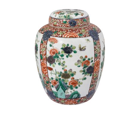 A late 19th century Chinese famille verte ginger jar and coverof ovoid tapering form, decorated with panels of lotus, prunus,