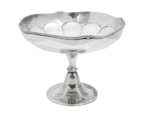 An Edwardian silver pedestal dishBirmingham, 1902, E S. Barnsley &amp; Cothe shallow panelled dish with wavy edged rim and ra