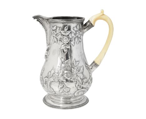 An early George III silver jugLondon, 1763, makers mark struck upside down for Louis Black of baluster form with beaded spout