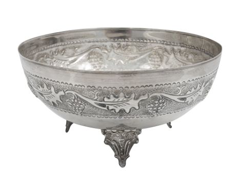 A continental silver bowlunmarked, probably Greek repousse embossed with a band of fruiting vine, on three bracket feetdiamet