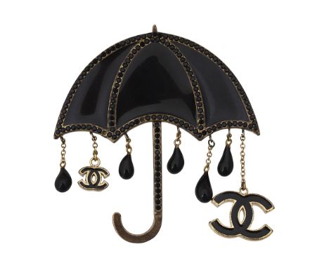 A black enamel and black crystal set umbrella pin by Chanelfeaturing addorsed CC, stamped to reverse 'CHANEL 02 A MADE IN FRA