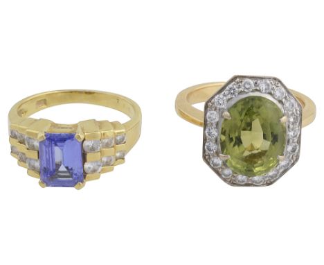 A peridot and diamond cluster ring and a tanzanite and diamond ring the first set with a central oval-cut peridot to the 18 b