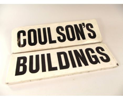 ARCHITECTURAL TILES. A pair of pottery architectural name tiles for Coulson's Buildings, Penzance. Each 15.5 x 49.5cm.