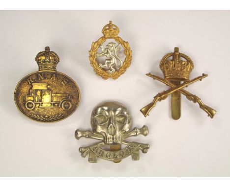 CAP BADGES.Four regimental cap badges: WWI RNAS Armoured Car Section, WWII Women's Royal Army Corps officers badge by Firmin 
