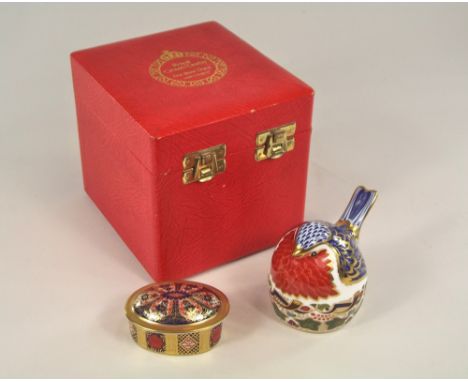 ROYAL CROWN DERBY. A Royal Crown Derby paperweight 'Robin Nesting'. Gilt button to base & with original box. Also, a Royal Cr