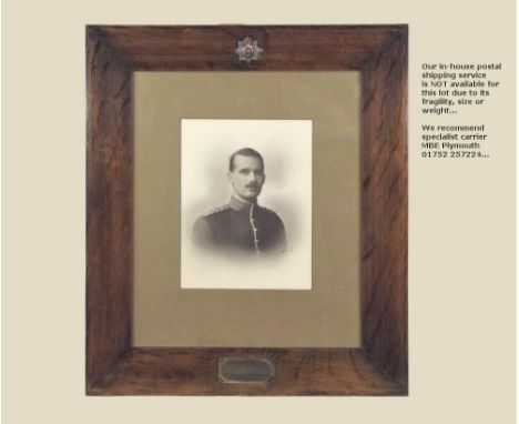 WWI PORTRAIT. A WWI photographic portrait of Captain E.J.W. Dolphin of the 1st Battalion Hampshire Regiment in oak frame with