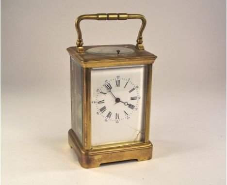 CARRIAGE CLOCK. A Swiss brass cased, repeater carriage clock. Dial cracked, with key. Height 18cm.