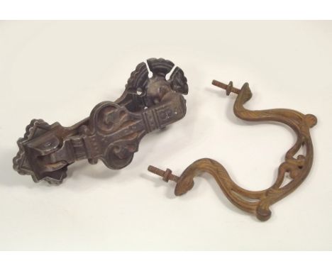 DOOR FURNITURE. A 19th century cast iron door knocker, 20cm & a French Art Nouveau door handle.