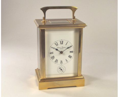 CARRIAGE CLOCK. A Charles Frodsham & Co Ltd., London brass cased carriage clock, the movement striking on a gong. With origin