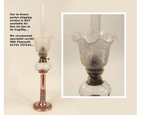 OIL LAMP. A 19th century oil lamp with copper column & etched glass shade. Height 57cm.